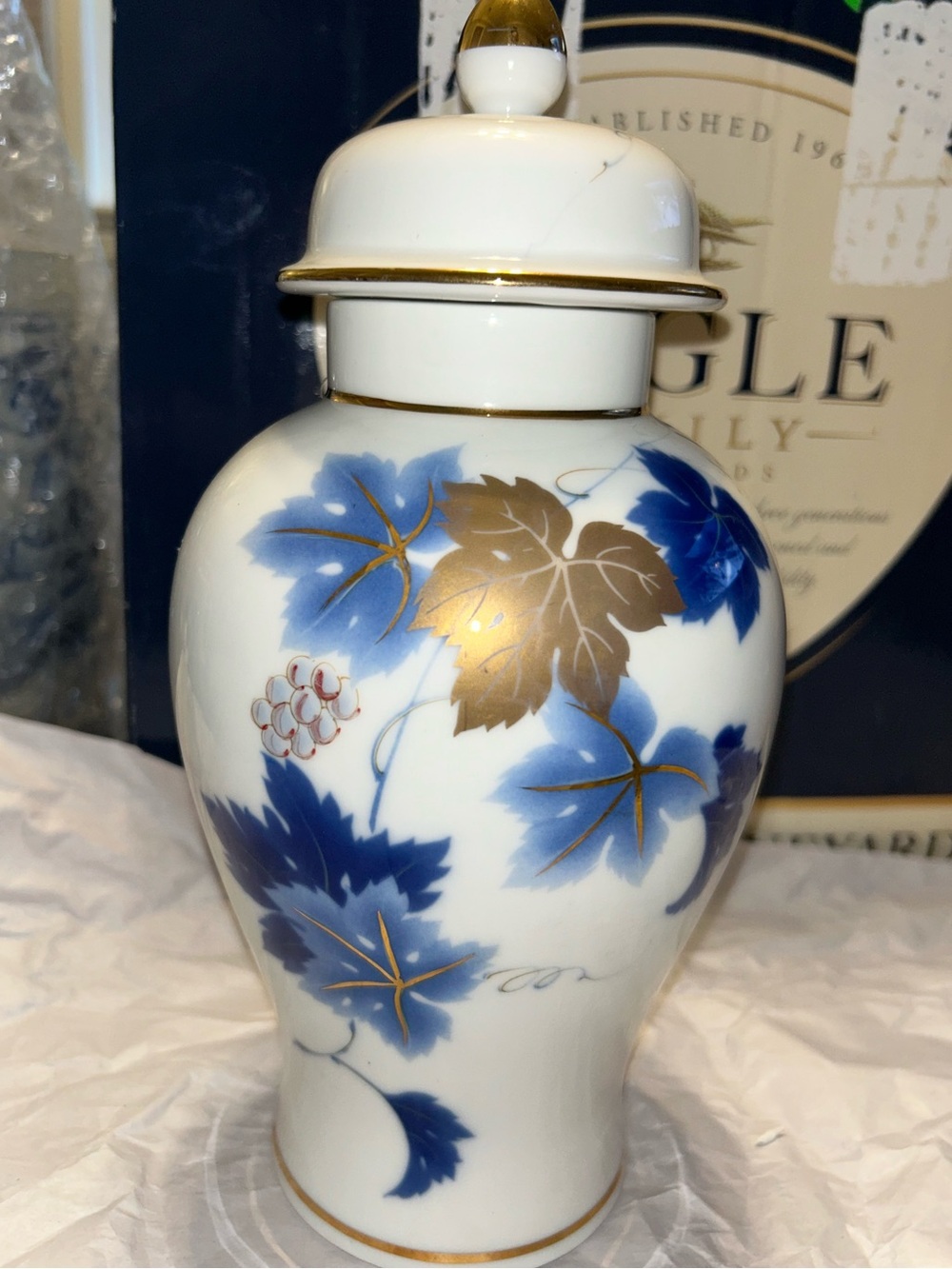 Vintage White porcelain ginger jar with blue grape leaf decoration and gold trim